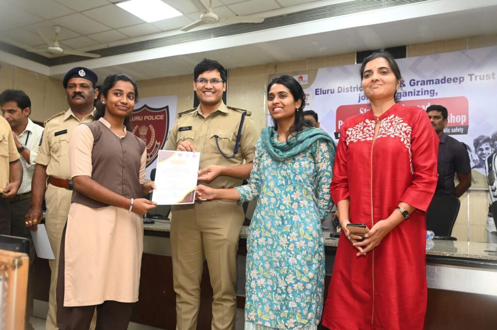 Students receiving certificates from the Elluru Police Department