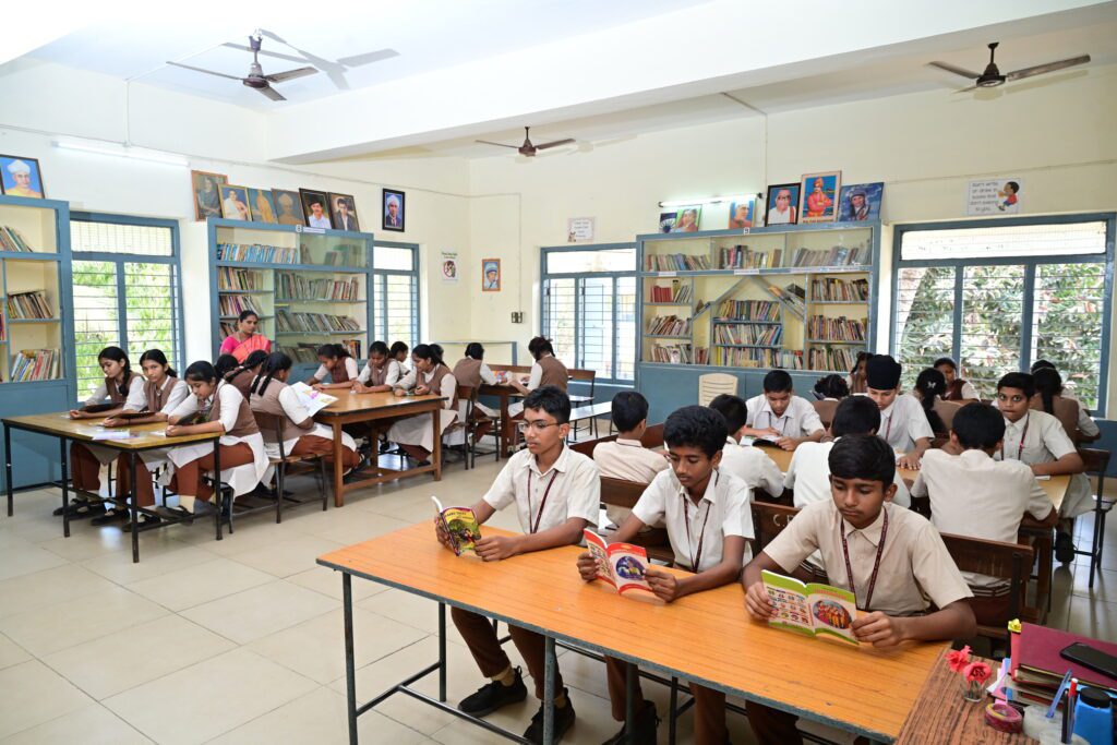 Bookshelves filled with books in the library at Sir C.R. Reddy School
