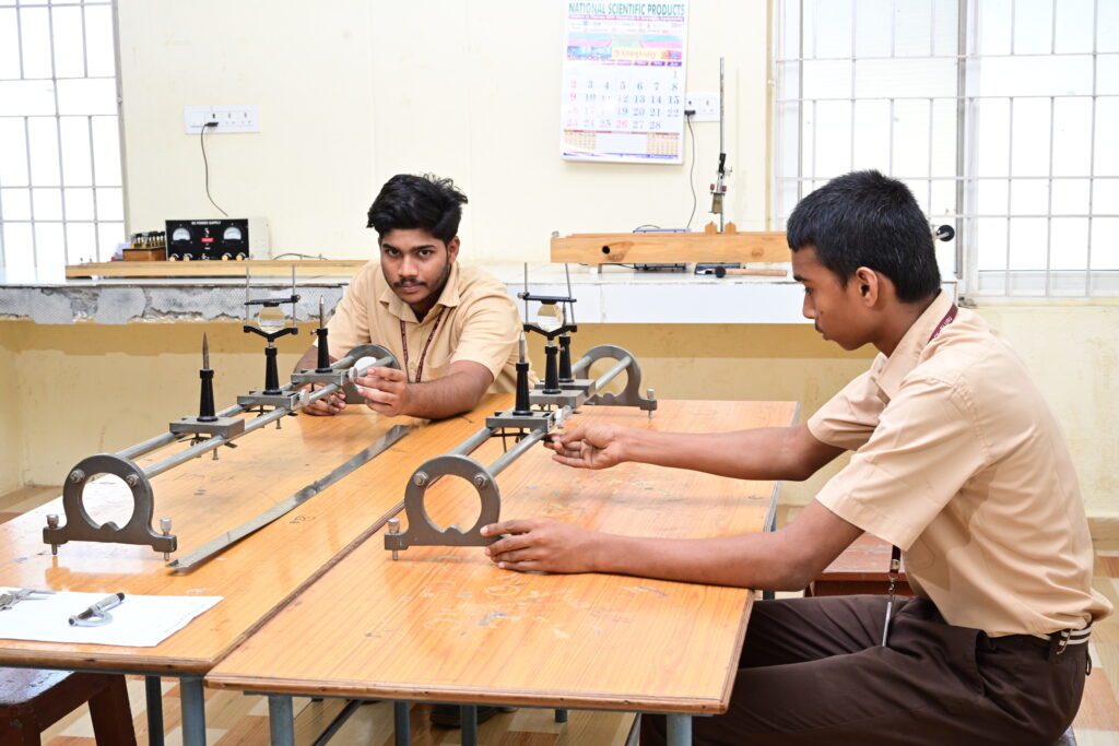 Physics lab at Sir C.R. Reddy School with scientific apparatus and student workstations